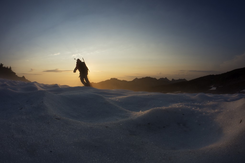 @hefe_steele getting his last few turns as the sun sets on Spray Park on Mount Rainier. The golden mist around him was water evaporating off the warming August snow.